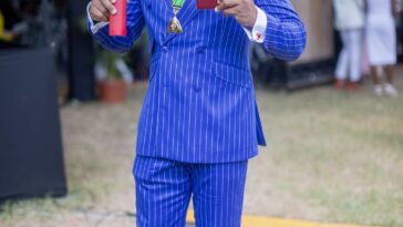 Yohan Blake accepts his national award, the Order of Distinction in the rank of Commander, on Oct. 20, 2025.