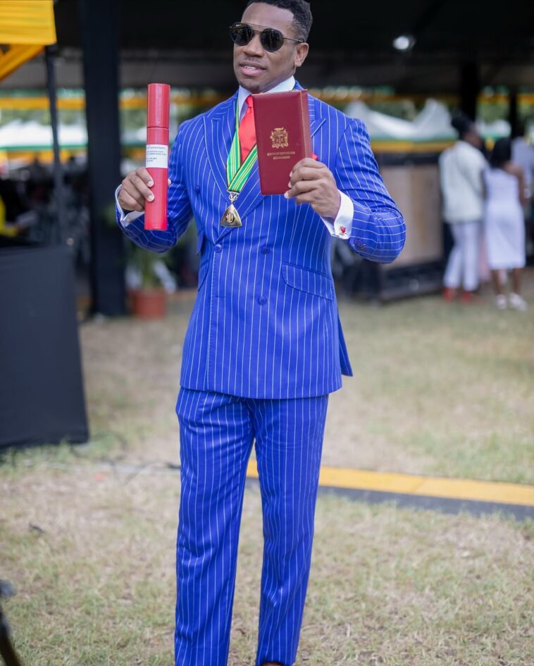 Yohan Blake accepts his national award, the Order of Distinction in the rank of Commander, on Oct. 20, 2025.