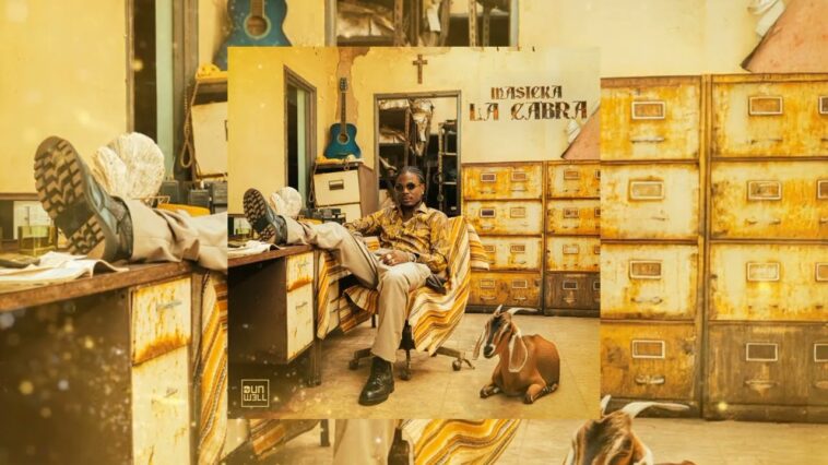 Masicka kicks his feet up during the music video for "La Cabra."