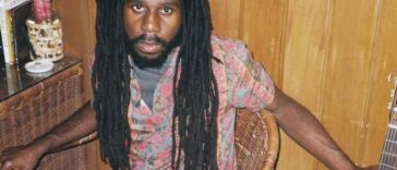 Chronixx poses with a guitar in a studio to promote his new album, "Exile."