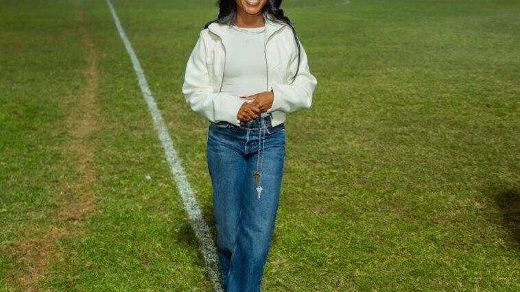 Shelly-Ann Fraser-Pryce on the field after being honoured at her hometown football team, Waterhouse FC.