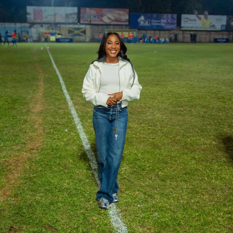 Shelly-Ann Fraser-Pryce on the field after being honoured at her hometown football team, Waterhouse FC.