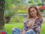 Ce'Cile sits in the park during the music video for "Baddest Love"