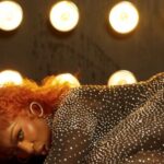 Spice positions herself in the music video for "Degree."