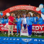 Edwin Allen athletes celebrates their Issa Girls Champs trophy.
