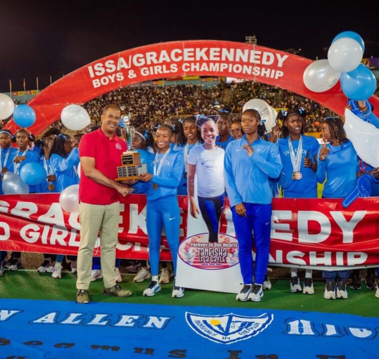 Edwin Allen athletes celebrates their Issa Girls Champs trophy.