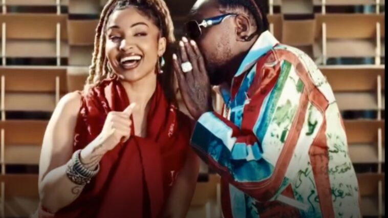 Shenseea receives a message from Vybz Kartel during their music video for "Talk To Me Nuh."