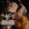 Masicka shows off his GOAT chain during the music video for "Boasty."