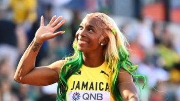 Mommy Rocket waves to the crowd at the 2022 IAAF World Championships