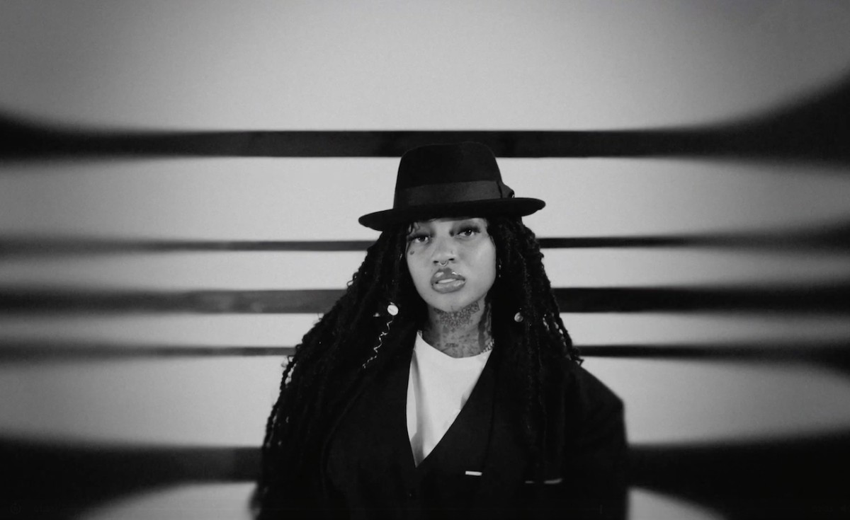 Jada Kingdom rocks a full suit in the music video for her single, "Still Searching."