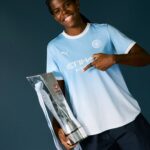 Khadija Shaw poses with the FA WSL title