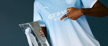 Khadija Shaw poses with the FA WSL title