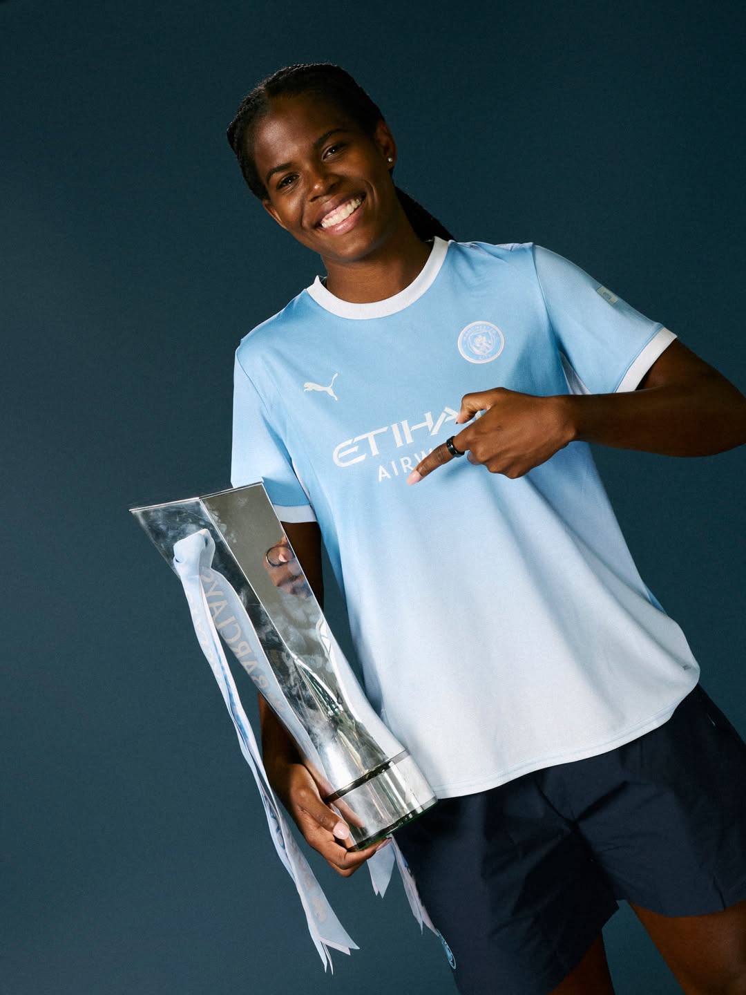 Khadija Shaw poses with the FA WSL title