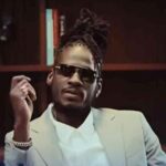 Aidonia looks on keenly during his music video for 'Like How Yuh Feel.'
