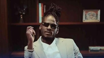 Aidonia looks on keenly during his music video for 'Like How Yuh Feel.'