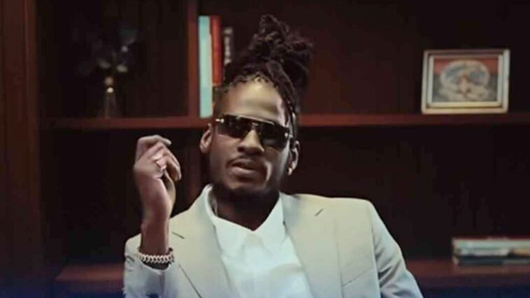 Aidonia looks on keenly during his music video for 'Like How Yuh Feel.'