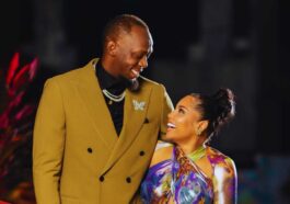 Usain Bolt looks lovingly at his partner, Kasi Bennett.