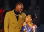 Usain Bolt looks lovingly at his partner, Kasi Bennett.