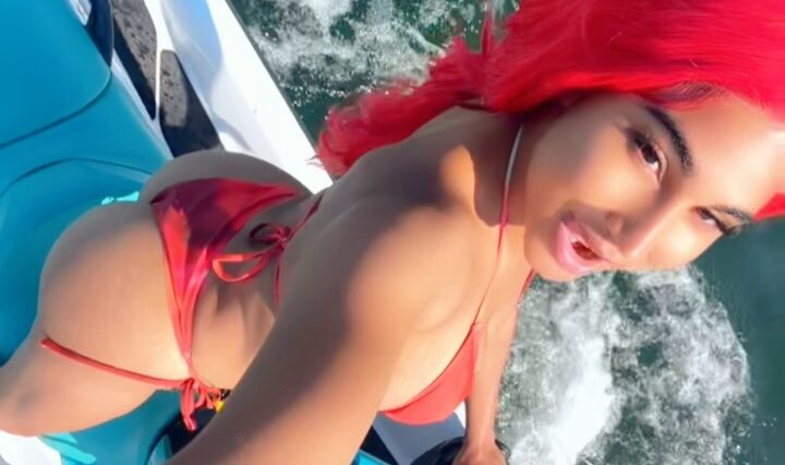 Nayda Vii shows off her sexy curves while sporting red hair while jet skiing in Toronto.