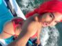 Nayda Vii shows off her sexy curves while sporting red hair while jet skiing in Toronto.