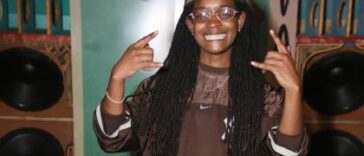 Koffee is all smiles while chilling on the endz by the stereo