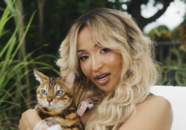 Shenseea pets a cat in her music video for 'Tightness.'