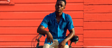 Reggae star Romain Virgo chills on his bike during his music video for 'No Substitute.'