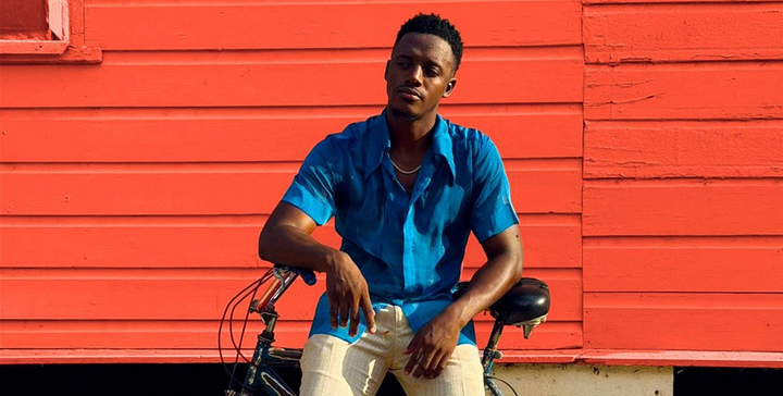 Reggae star Romain Virgo chills on his bike during his music video for 'No Substitute.'